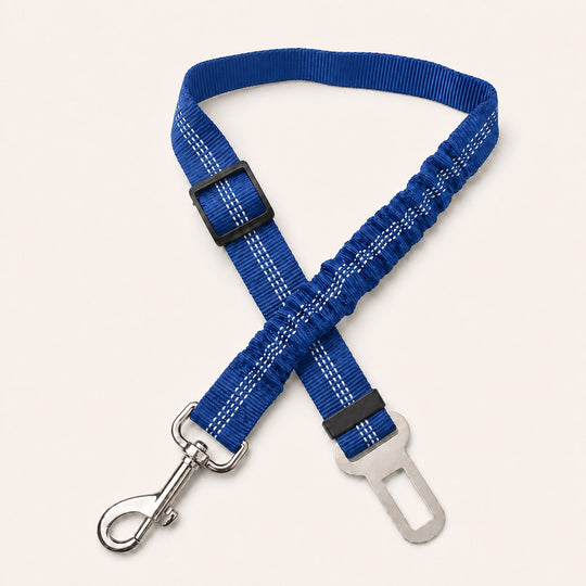 Dark Blue SafeBelt adjustable dog car seat belt on a warm cream background