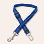 Dark Blue SafeBelt adjustable dog car seat belt on a warm cream background
