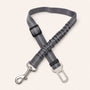 Gray SafeBelt adjustable dog car seat belt on a warm cream background